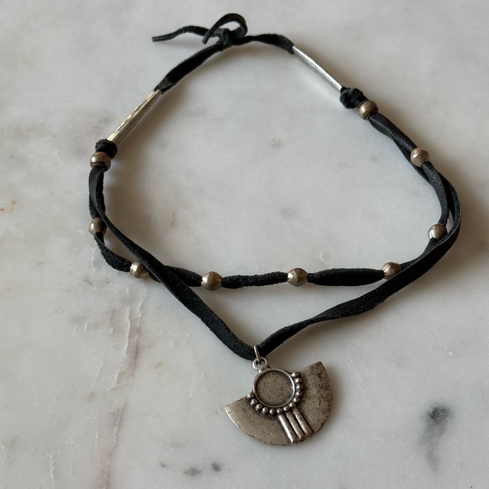 Black leather choker necklace with silver pendant